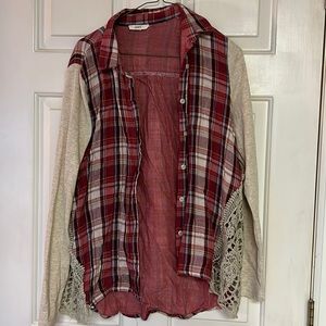 Oddy. Flannel type shirt with red, light blue, and tan colors.